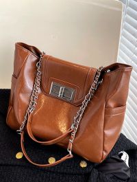 « Esplorando l’Eleganza della Borsa Donna Lydia: Un Accessorio Firmato in Bianco, Nero, Verde e Caramello »